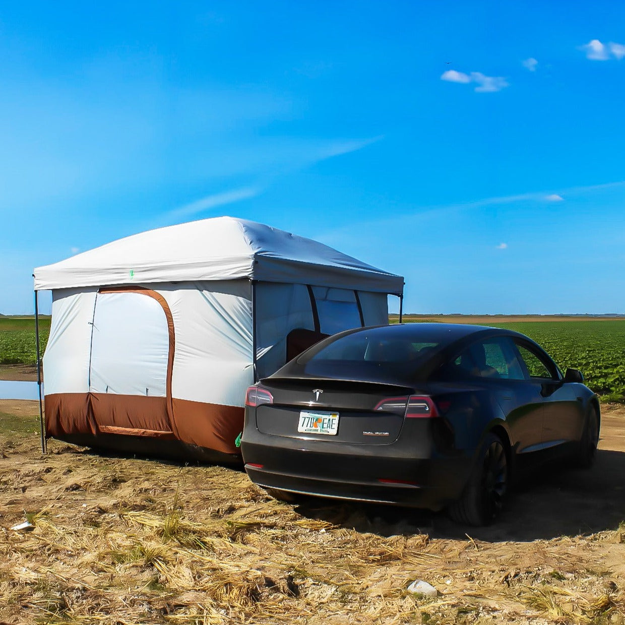 Our innovative E-Tent attaches to any Tesla's driver window, powering air conditioning with the car's AC unit. Lightweight, easy to set up, and suitable for various camping environments, it's made of durable, waterproof material. The spacious interior comfortably fits two people and includes a built-in power outlet for charging devices while camping.